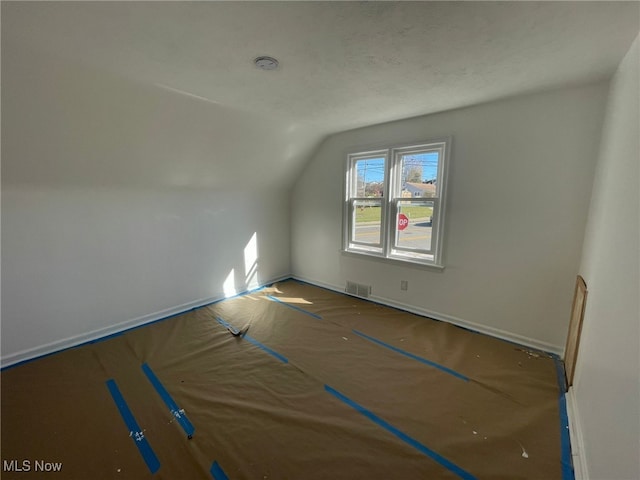 bonus room with lofted ceiling