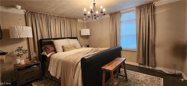 bedroom with wood-type flooring, a textured ceiling, crown molding, and a notable chandelier