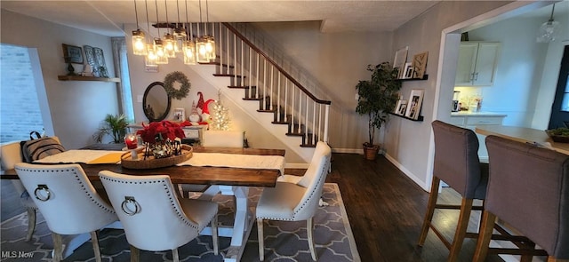 dining room featuring dark hardwood / wood-style floors and a notable chandelier