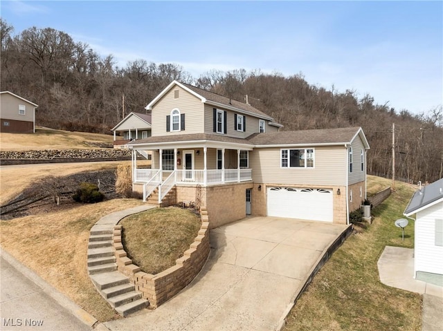 view of front of property with concrete driveway, roof with shingles, an attached garage, covered porch, and central air condition unit