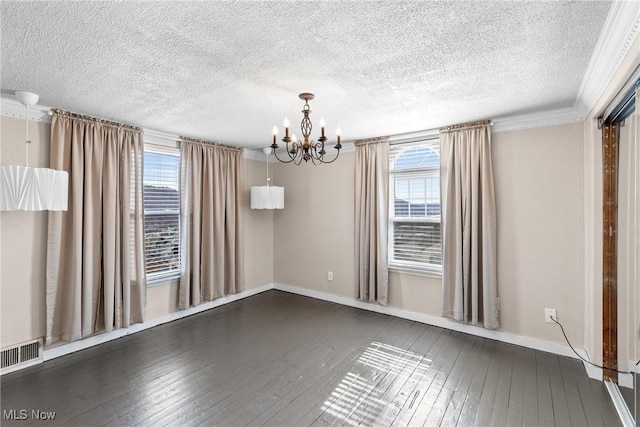 empty room featuring a textured ceiling, a chandelier, visible vents, baseboards, and dark wood-style floors