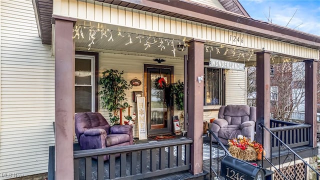 entrance to property featuring covered porch