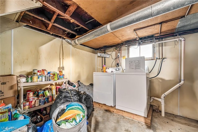 clothes washing area featuring washer and dryer