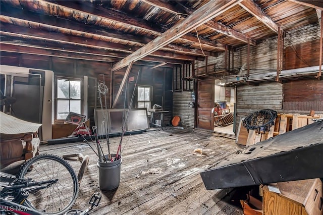 miscellaneous room with beamed ceiling, wood ceiling, and wooden walls