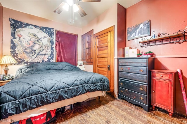 bedroom with hardwood / wood-style floors and ceiling fan