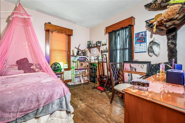 bedroom featuring wood-type flooring