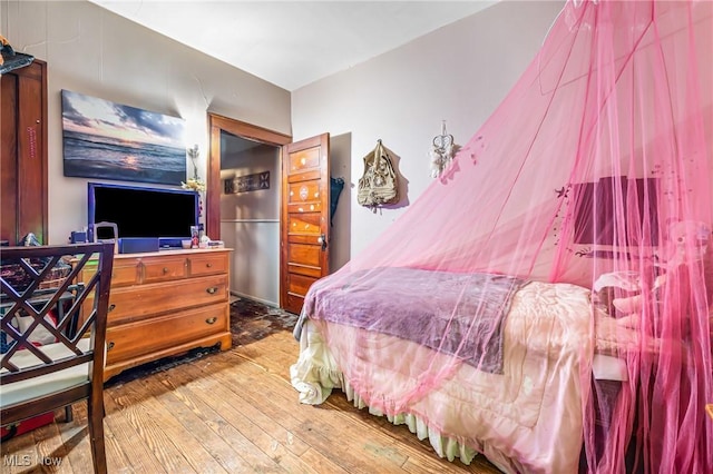 bedroom with wood-type flooring