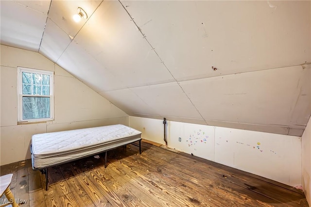 bedroom featuring wood-type flooring and lofted ceiling