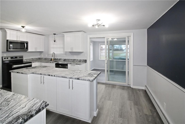 kitchen with white cabinetry, hanging light fixtures, appliances with stainless steel finishes, and a baseboard radiator