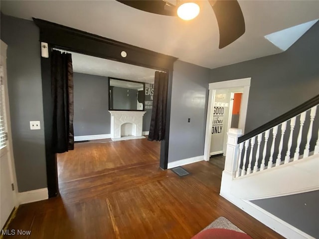 hallway with dark hardwood / wood-style floors