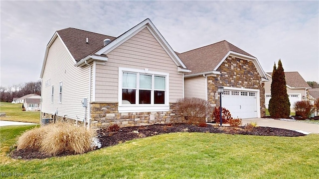 view of front facade featuring a garage and a front lawn