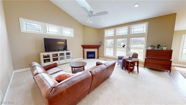 living room with light carpet, high vaulted ceiling, and ceiling fan