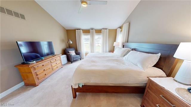 carpeted bedroom featuring ceiling fan and vaulted ceiling