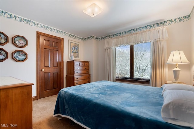 bedroom with light colored carpet