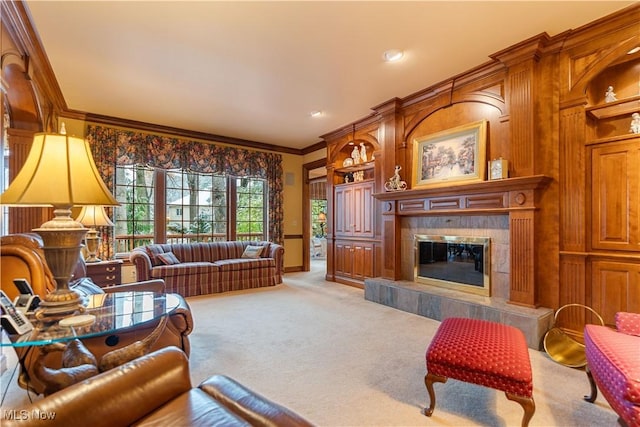 living area featuring a fireplace, carpet, baseboards, and ornamental molding