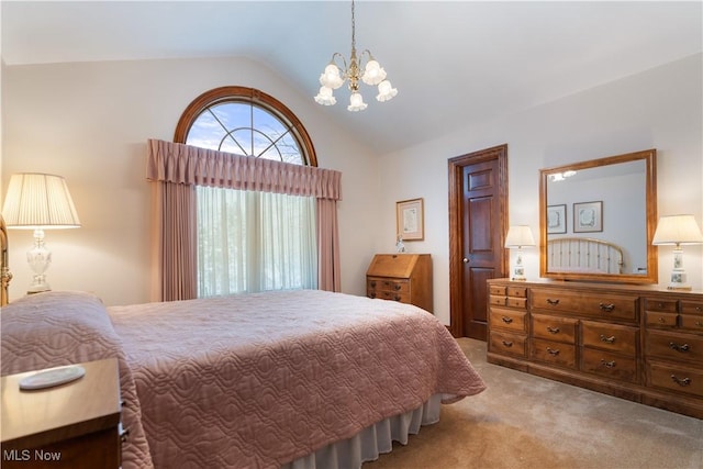 bedroom featuring light carpet, a notable chandelier, and lofted ceiling