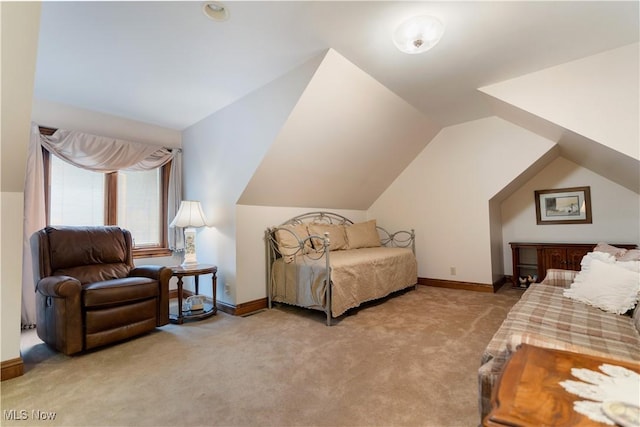 bedroom featuring lofted ceiling, baseboards, and light carpet