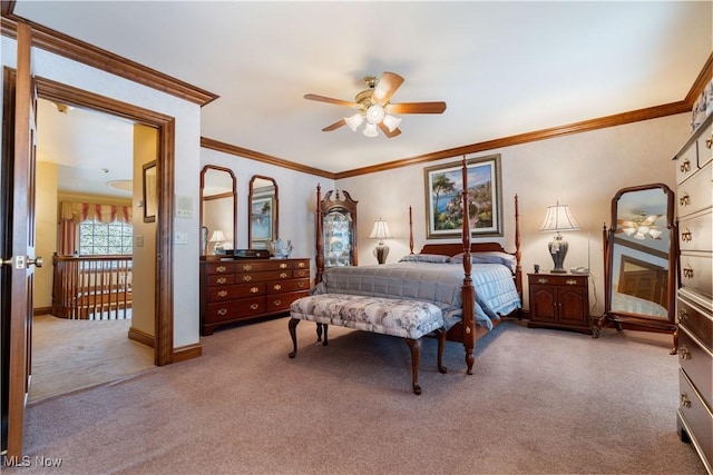 bedroom with light carpet, ceiling fan, crown molding, and baseboards