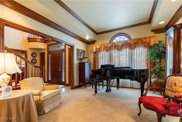 sitting room featuring ornamental molding, stairs, baseboards, and carpet floors