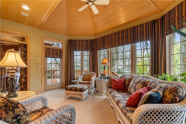 sunroom / solarium featuring wooden ceiling, vaulted ceiling, and ceiling fan