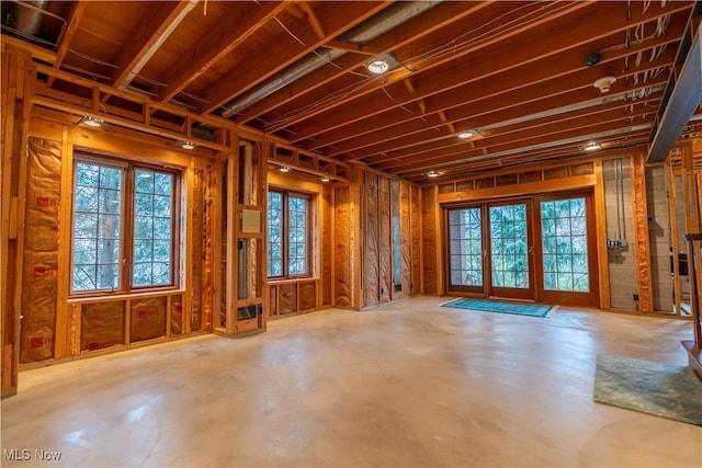 misc room with plenty of natural light and concrete floors