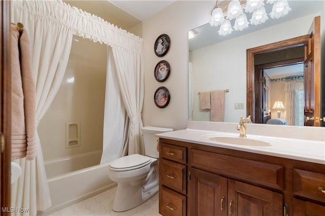 bathroom featuring toilet, shower / tub combo with curtain, and vanity