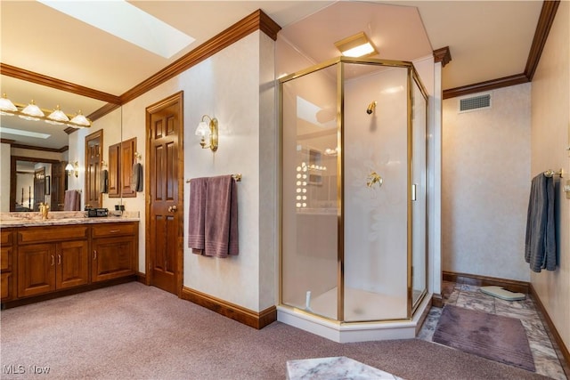 bathroom with visible vents, ornamental molding, a stall shower, a skylight, and vanity