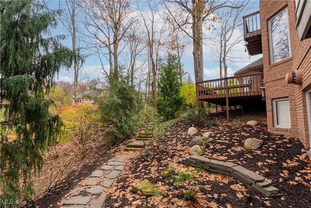 view of yard featuring a wooden deck