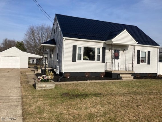 view of front of home with an outbuilding, a front lawn, and a garage