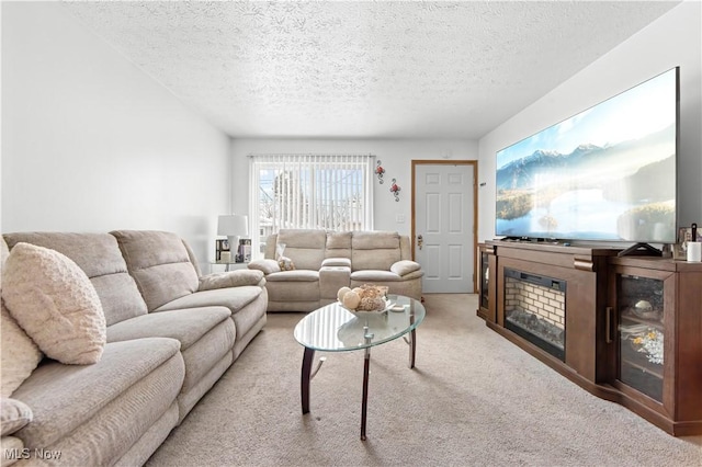 carpeted living room with a textured ceiling