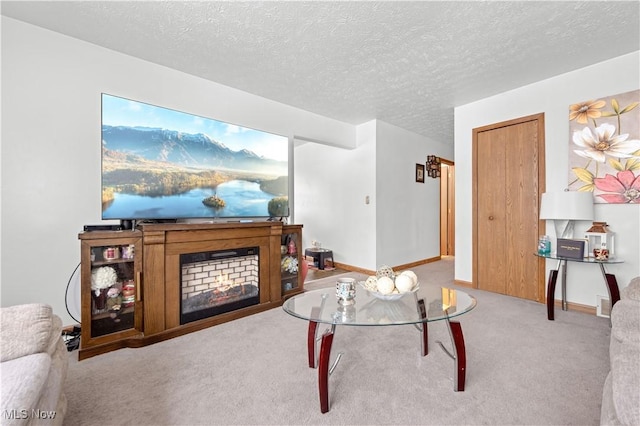 carpeted living room with a textured ceiling