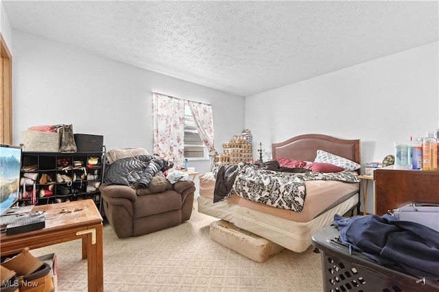 carpeted bedroom with a textured ceiling