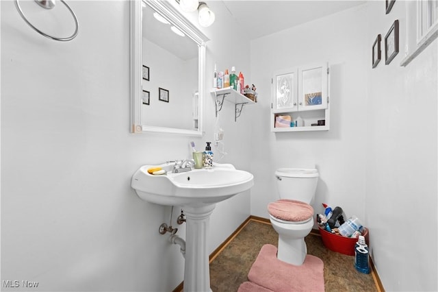 bathroom with sink and toilet