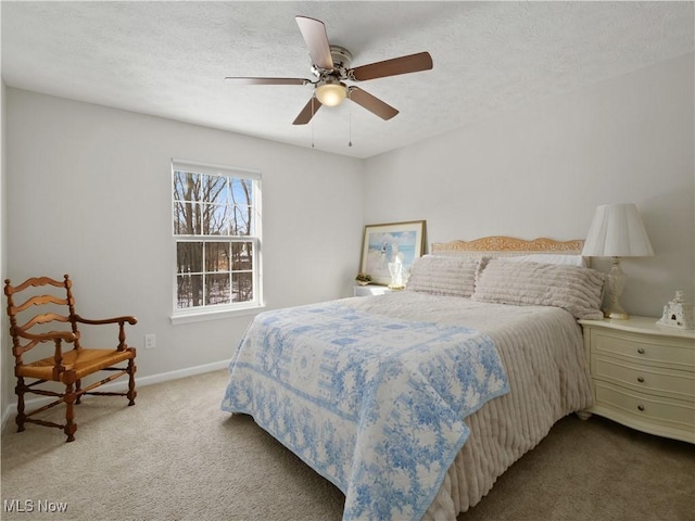 bedroom featuring carpet, a textured ceiling, and ceiling fan