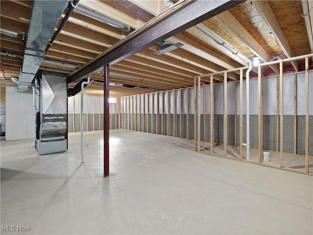 basement featuring heating unit