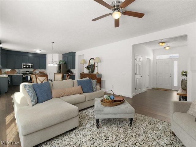 living room featuring hardwood / wood-style flooring and ceiling fan