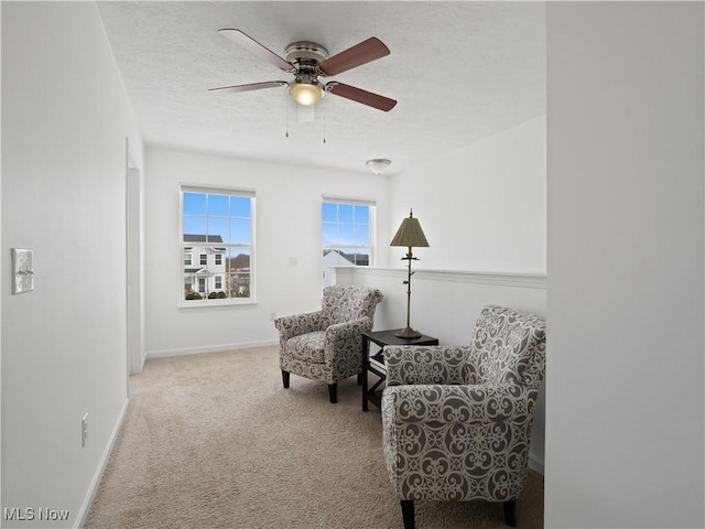 sitting room with light carpet and ceiling fan