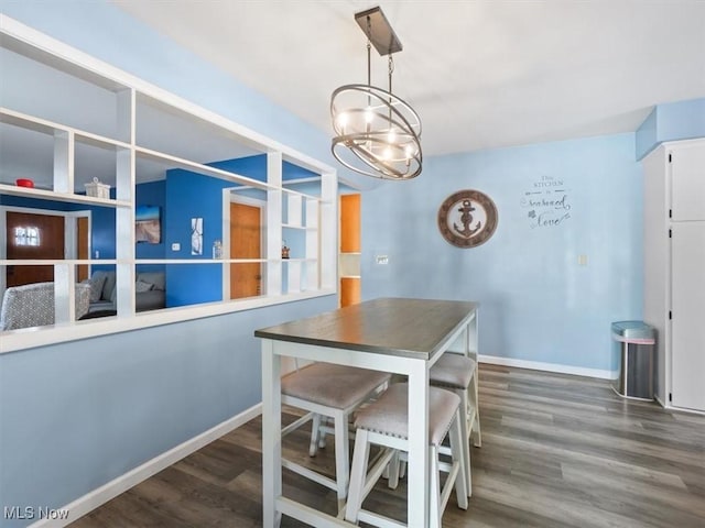 7630 Darling Ave, Conneaut, OH 44030 - dining room featuring baseboards, an inviting chandelier, and wood finished floors