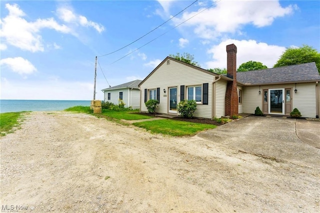 7630 Darling Ave, Conneaut, OH 44030 - ranch-style home with a water view, a chimney, and driveway