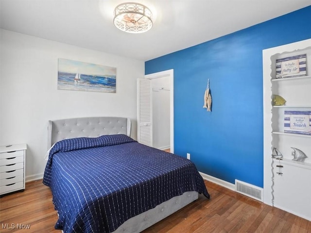 bedroom featuring wood-type flooring