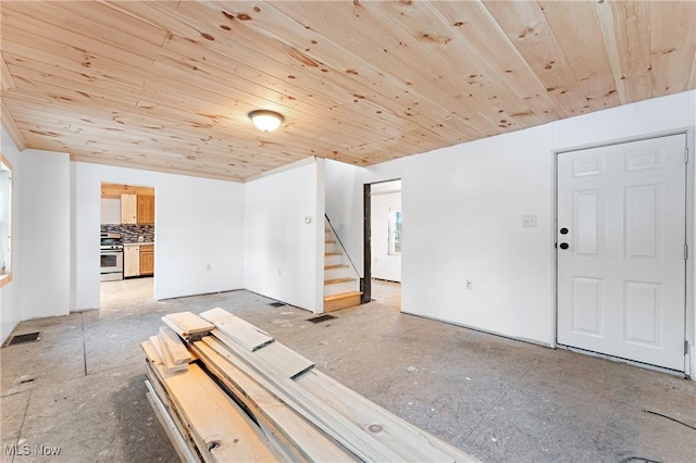 empty room featuring wooden ceiling