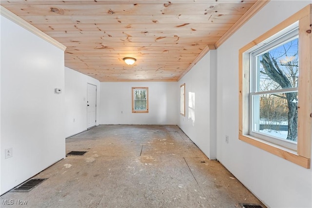 empty room featuring wood ceiling and crown molding