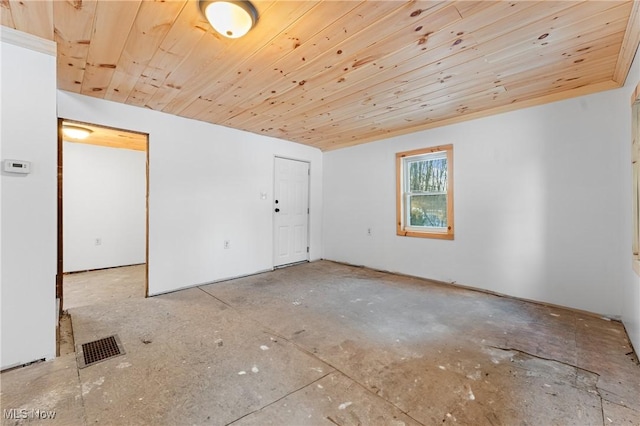 spare room featuring wood ceiling