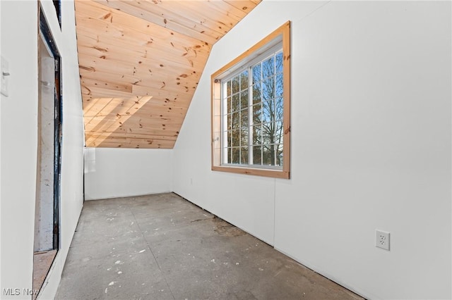 bonus room featuring vaulted ceiling and wood ceiling