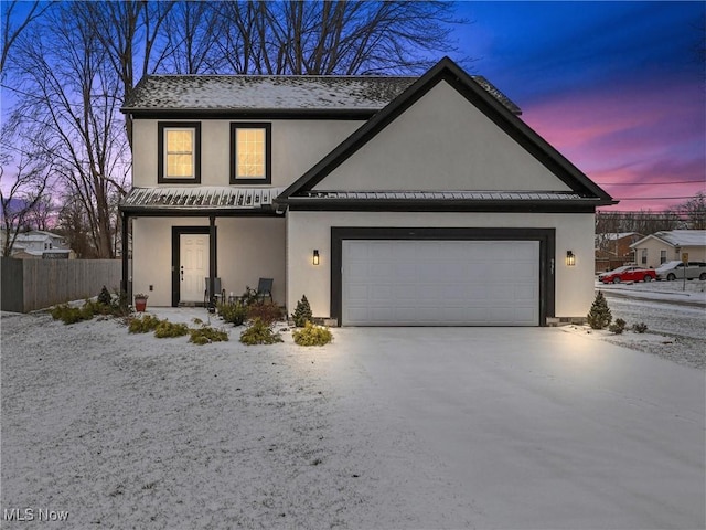 view of front of property with a garage