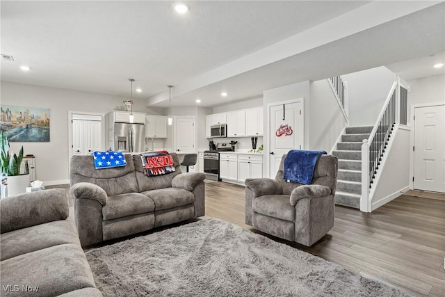 living room with hardwood / wood-style flooring