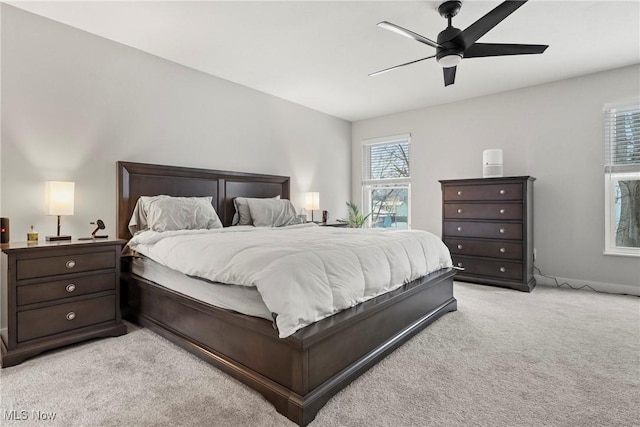 bedroom featuring ceiling fan and light colored carpet