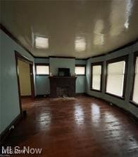 unfurnished living room featuring a fireplace