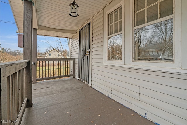 wooden terrace with a porch