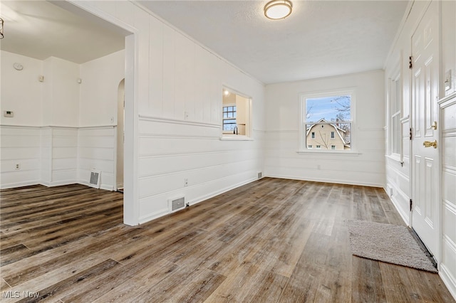 spare room with hardwood / wood-style floors